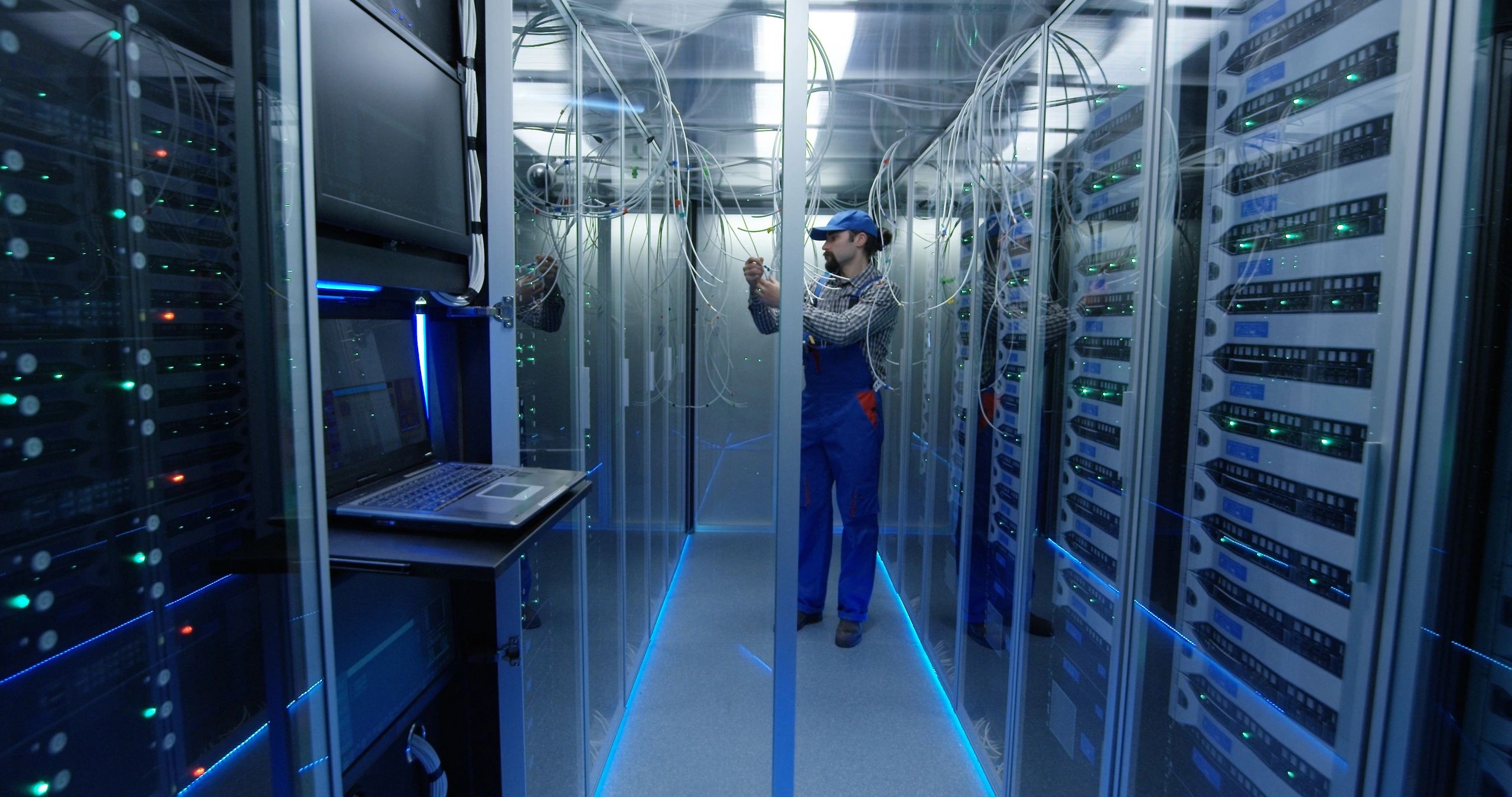 Technician working in a data centre environment