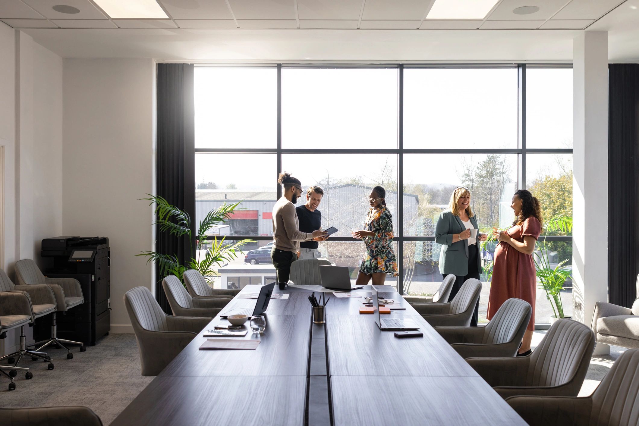 Business colleagues discussing technology planning in an office